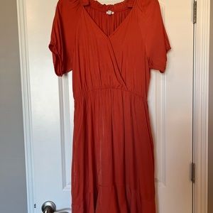 Ingrid Ruffle Dress in Tangerine with pockets.